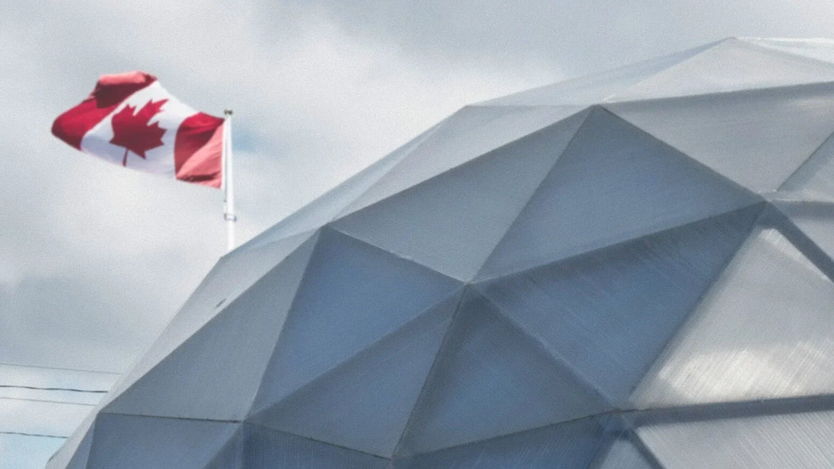 Canadian flag beside a Growing Dome