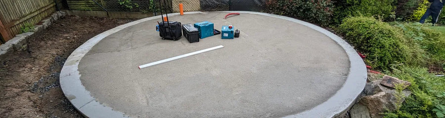 A circular concrete slab foundation ready for a GeoHome